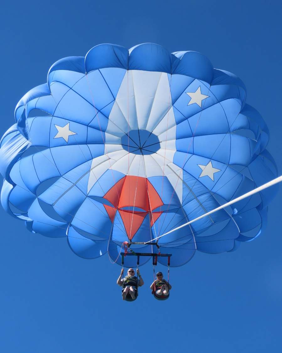 Solve Parasailing off Cocoa Beach jigsaw puzzle online with 42 pieces
